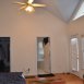 HUGE first floor master bedroom with wood floors, volume ceilings, a walk in closet & it's own private, luxury bath!
