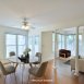Virtually staged dining area & family room-great natural light & beautiful wood floors!!