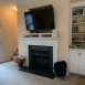 Family room has a fireplace with gas logs, built ins and place to mount TV.